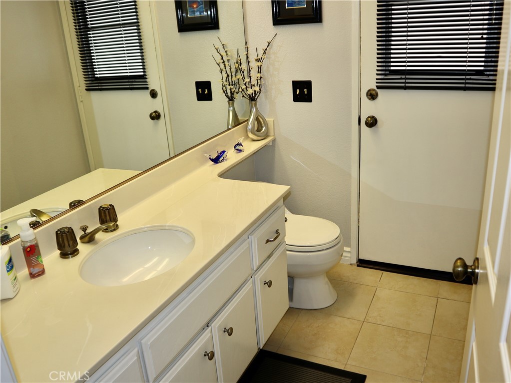 21475 Dickinson Road Moreno Valley, CA 92557 - Photo 17 of 41 a bathroom with a sink toilet and shower