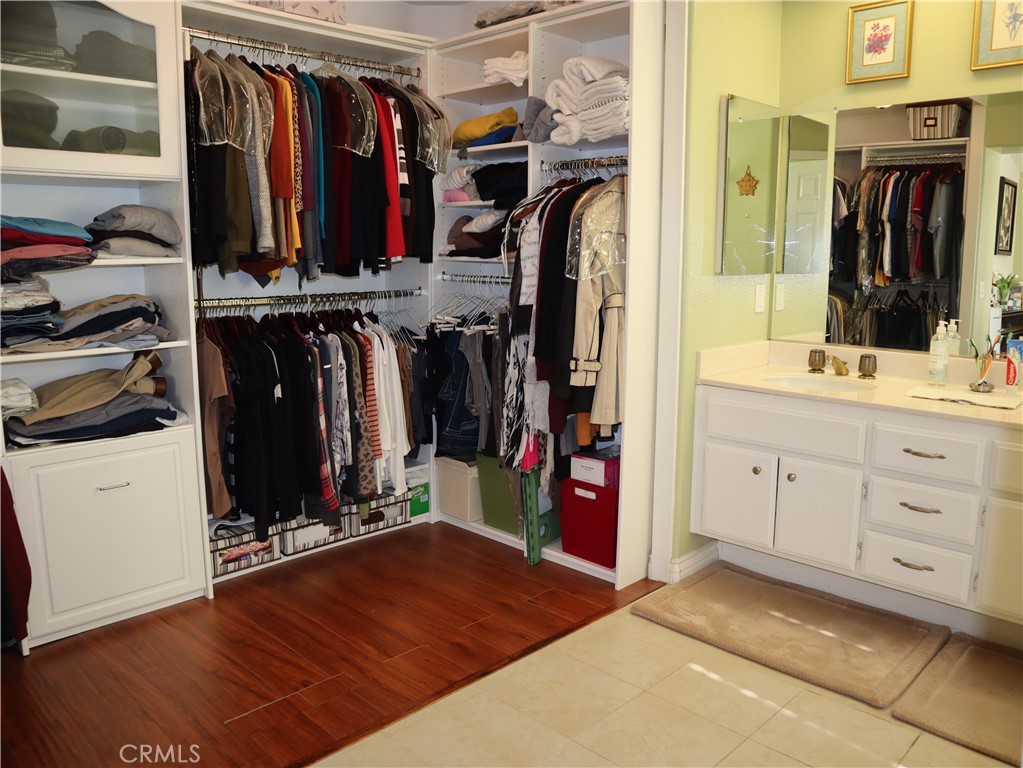 21475 Dickinson Road Moreno Valley, CA 92557 - Photo 21 of 41 a view of walk in closet with clothes and shoes