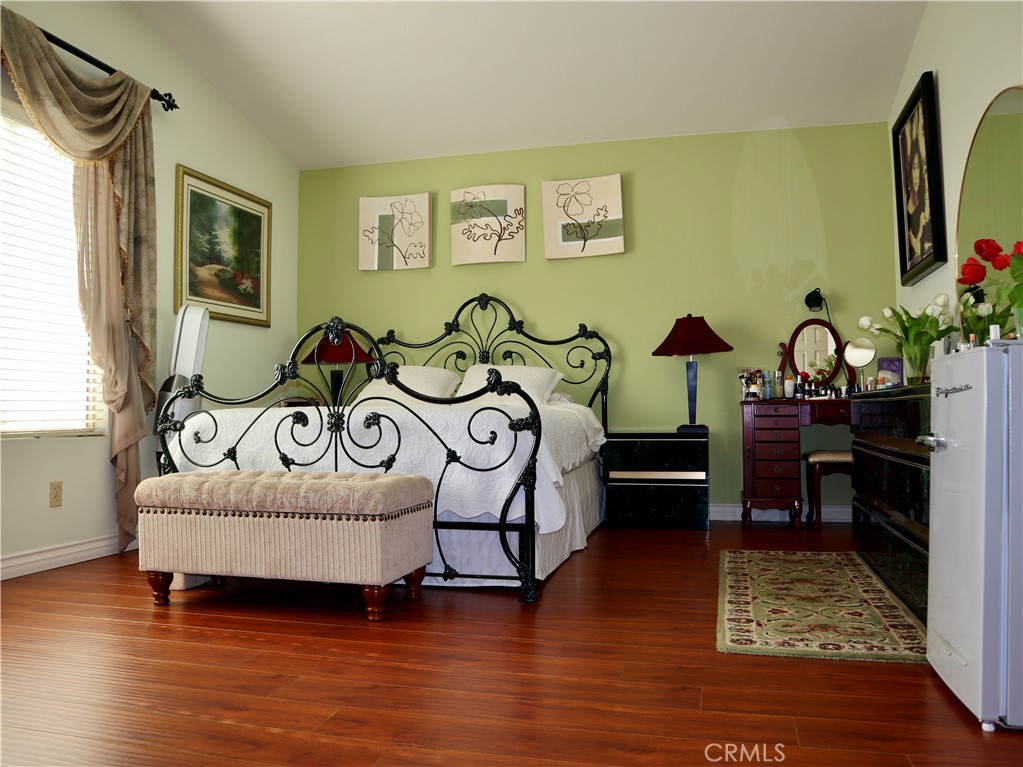 21475 Dickinson Road Moreno Valley, CA 92557 - Photo 22 of 41 a bedroom with furniture and a wooden floor