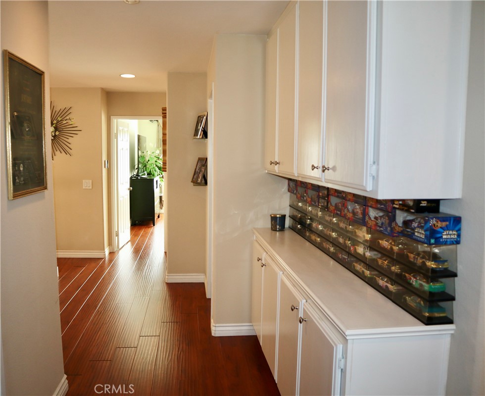 21475 Dickinson Road Moreno Valley, CA 92557 - Photo 28 of 41 a kitchen with a sink and refrigerator
