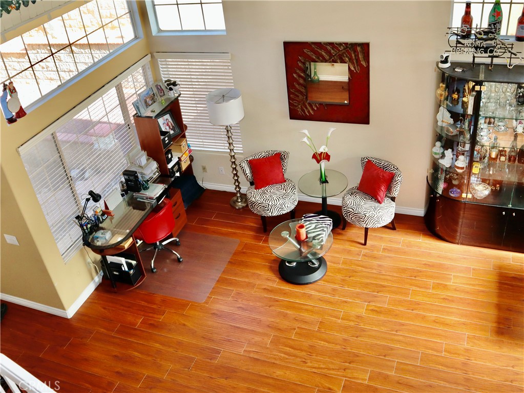 21475 Dickinson Road Moreno Valley, CA 92557 - Photo 32 of 41 a living room with furniture and a wooden floor