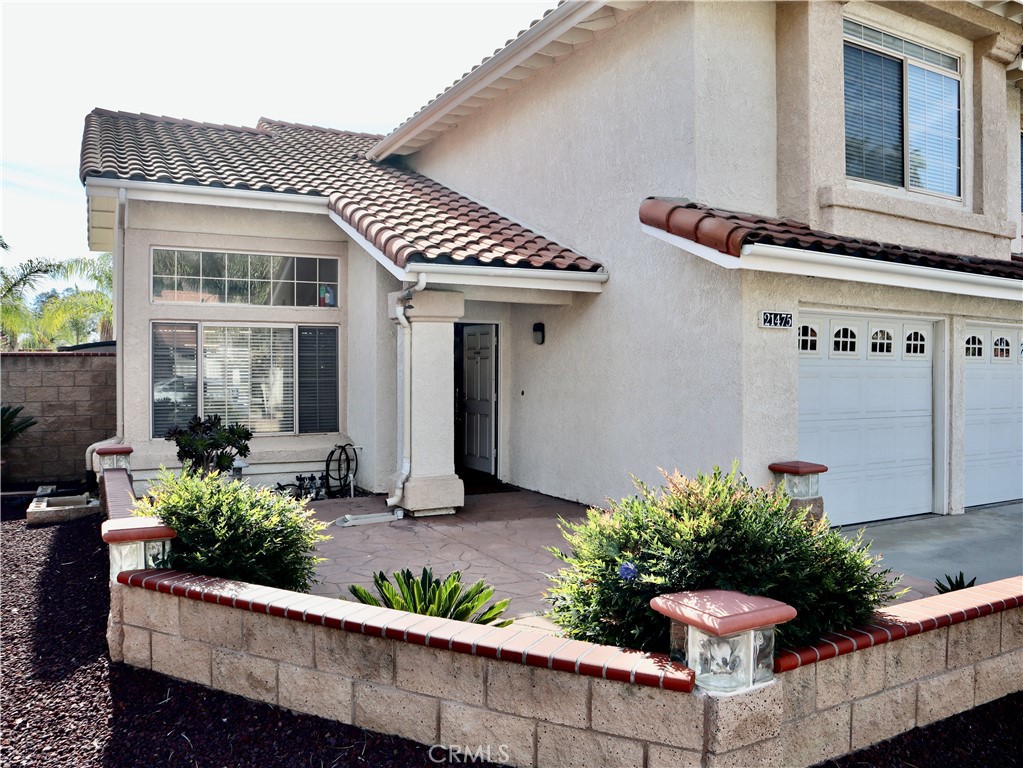21475 Dickinson Road Moreno Valley, CA 92557 - Photo 5 of 41 a front view of a house with a yard