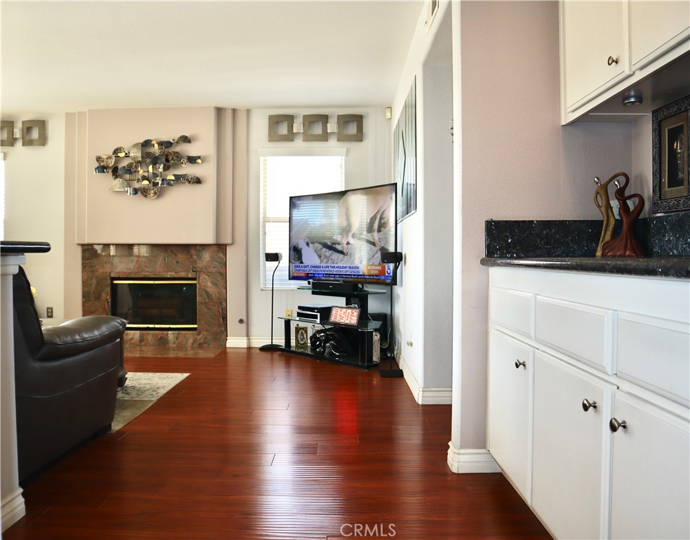 21475 Dickinson Road Moreno Valley, CA 92557 - Photo 10 of 41 a living room with furniture and a fireplace