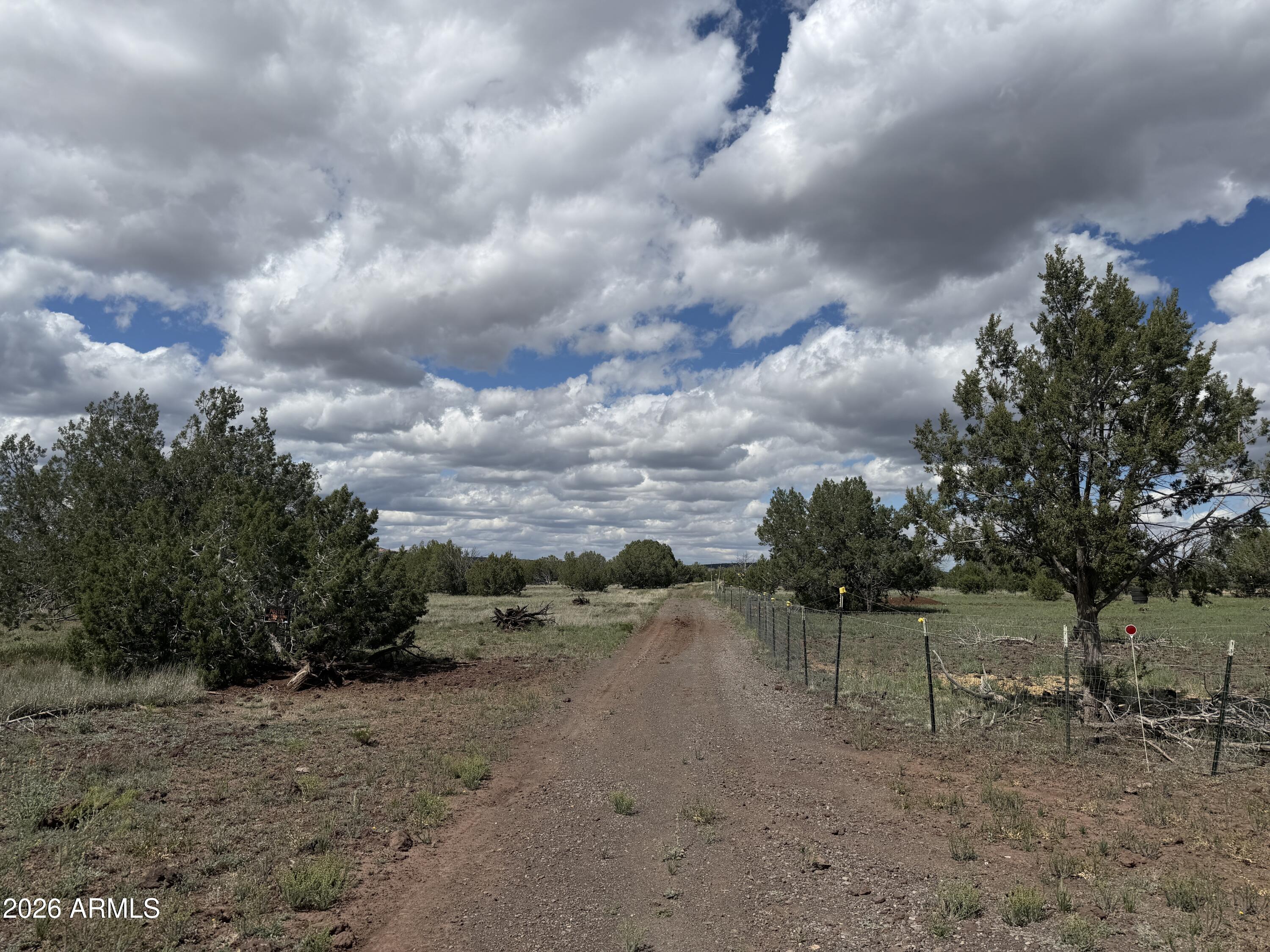 1 Hideaway Road Ash Fork, AZ 86320 - Photo 33 of 43 a view of a dry yard with wooden fence