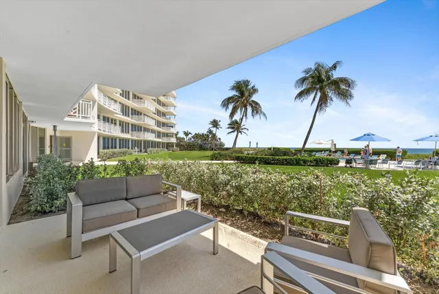 a view of a yard with furniture