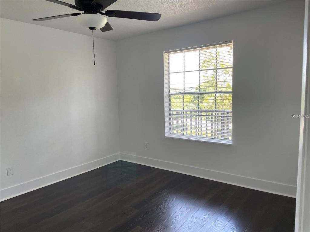 199 Afton Square, Unit 309 Altamonte Springs, FL 32714 - Photo 12 of 17 wooden floor in an empty room with a window