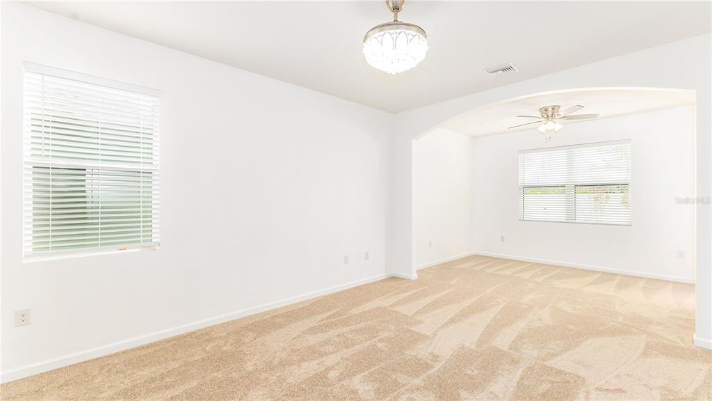 1723 Musgrass Circle Melbourne, FL 32904 - Photo 14 of 31 a view of an empty room with a window