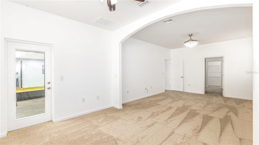 1723 Musgrass Circle Melbourne, FL 32904 - Photo 15 of 31 a view of an empty room with glass door