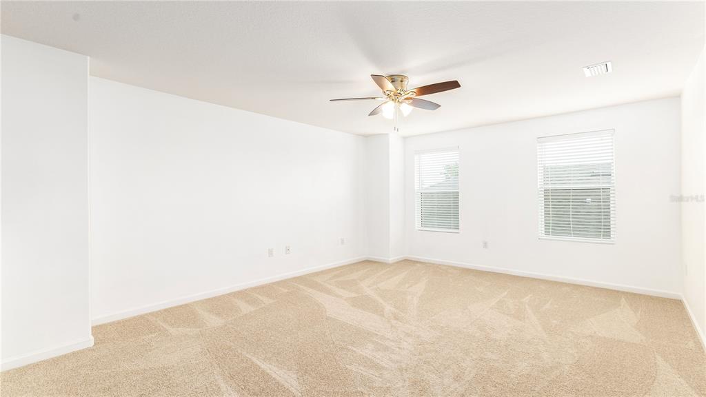 1723 Musgrass Circle Melbourne, FL 32904 - Photo 20 of 31 a view of an empty room with a window