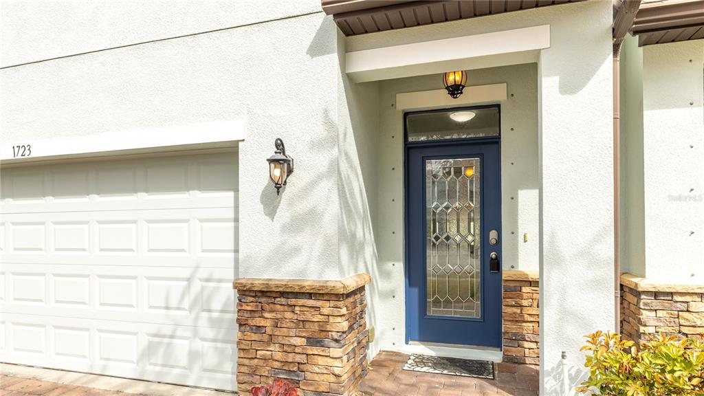 1723 Musgrass Circle Melbourne, FL 32904 - Photo 2 of 31 a front view of a house with white walls