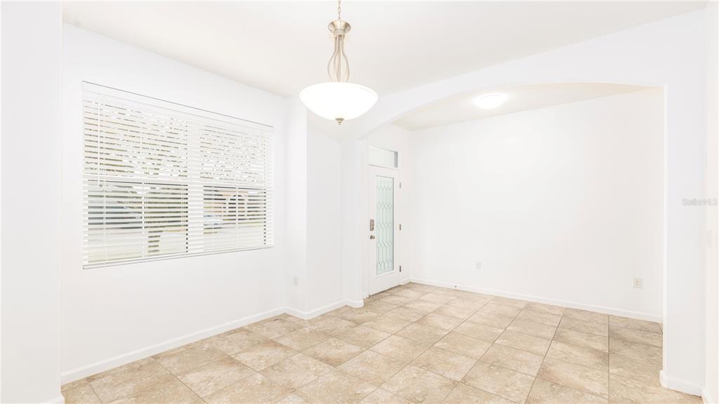 1723 Musgrass Circle Melbourne, FL 32904 - Photo 5 of 31 a view of an empty room with a window