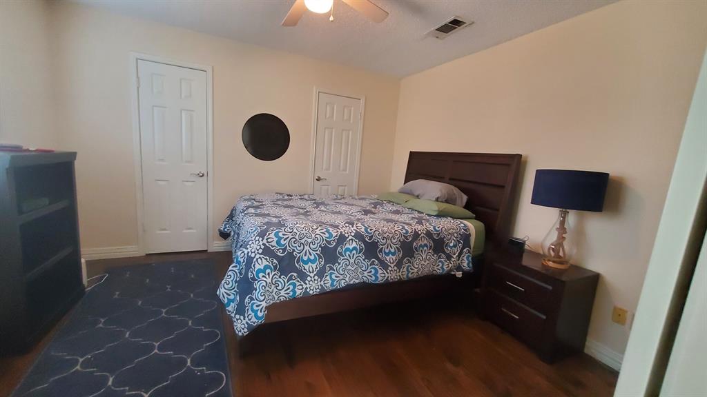 2413 Autumndale Drive Mesquite, TX 75150 - Photo 10 of 14 a bedroom with a bed and a window