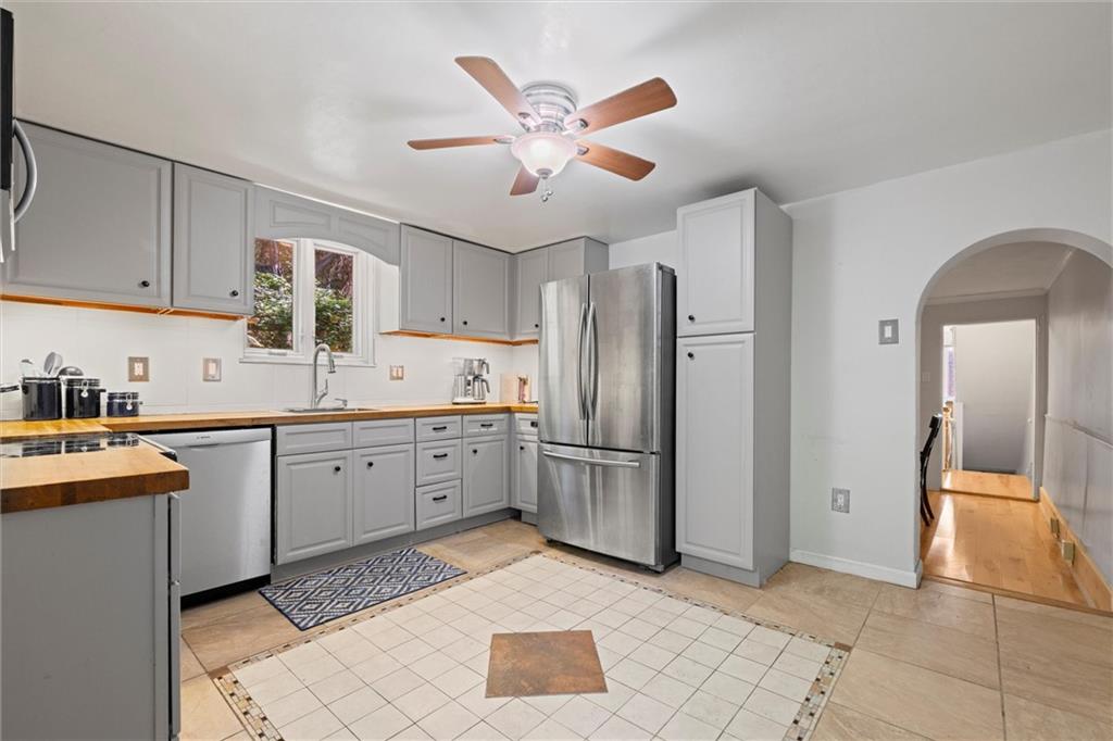 520 Knoll Street Pittsburgh, PA 15212 - Photo 14 of 47 a open kitchen with stainless steel appliances granite countertop a refrigerator and a sink