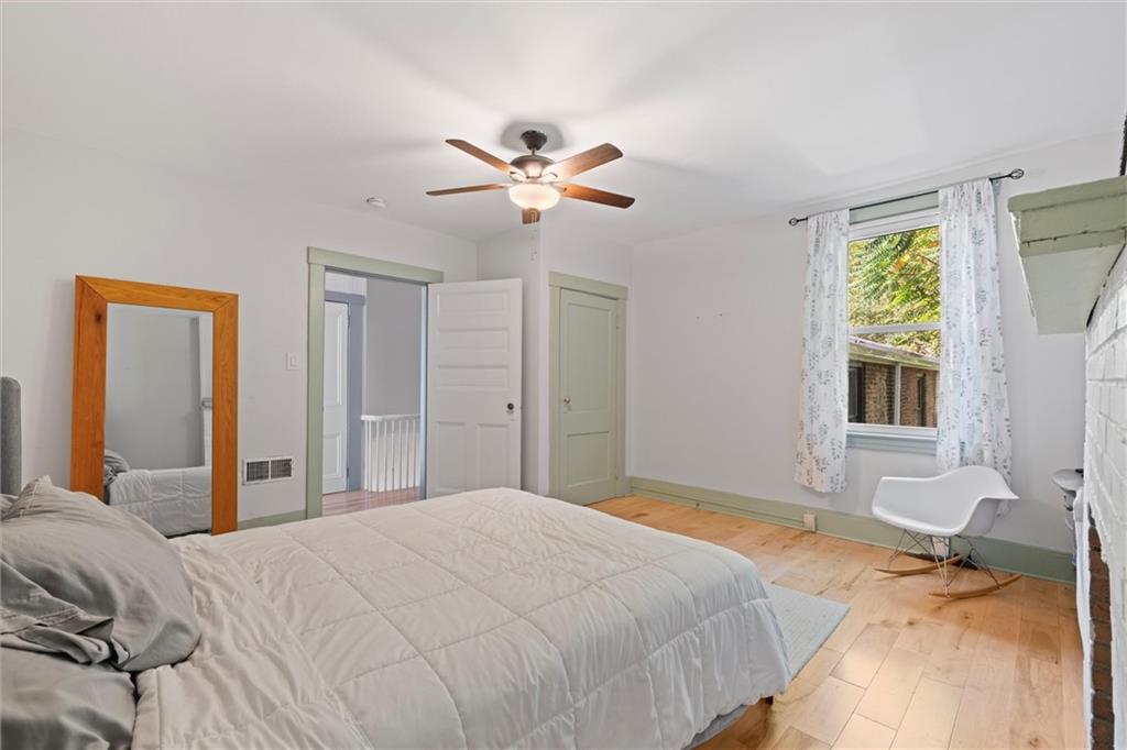 520 Knoll Street Pittsburgh, PA 15212 - Photo 23 of 47 a bedroom with a bed and a chandelier