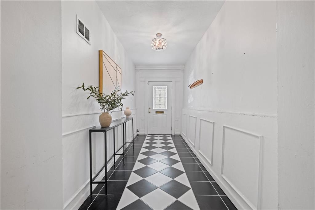 520 Knoll Street Pittsburgh, PA 15212 - Photo 29 of 47 a view of a hallway to a house with wooden floor