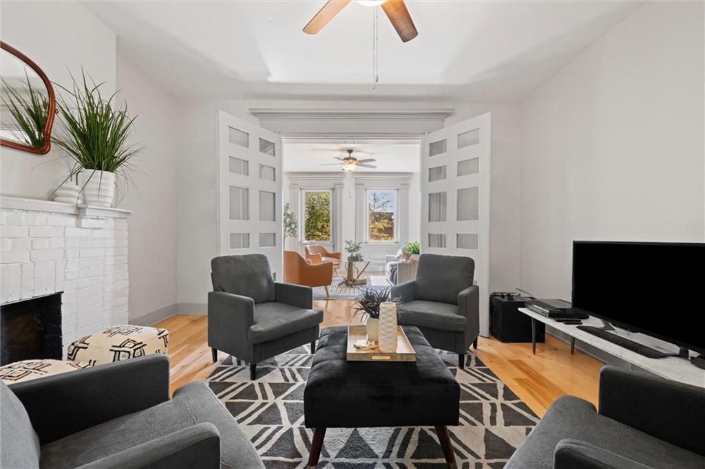 520 Knoll Street Pittsburgh, PA 15212 - Photo 8 of 47 a living room with furniture and a flat screen tv