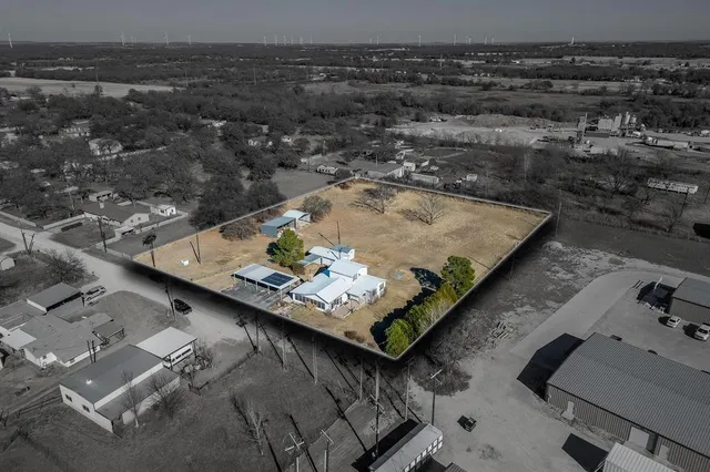 an aerial view of house with yard