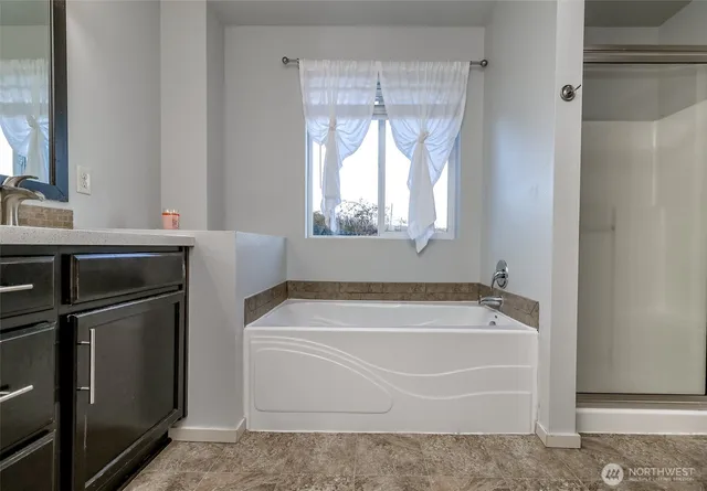 a en suite bathroom with a sink and a mirror