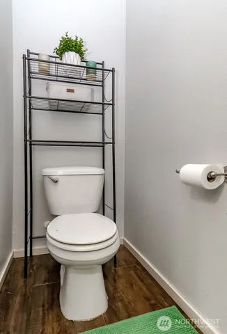 a bathroom with a toilet and a sink
