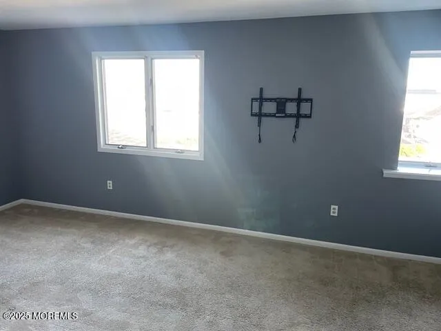 a view of a lake with boats and trees