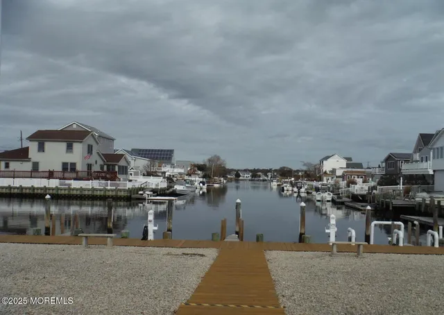 an aerial view of a house with a lake view