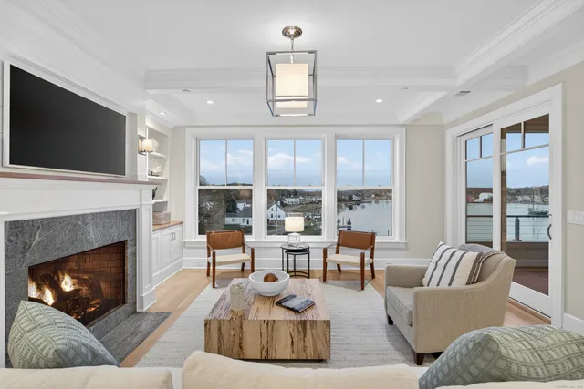 a large kitchen with kitchen island a dining table and chairs