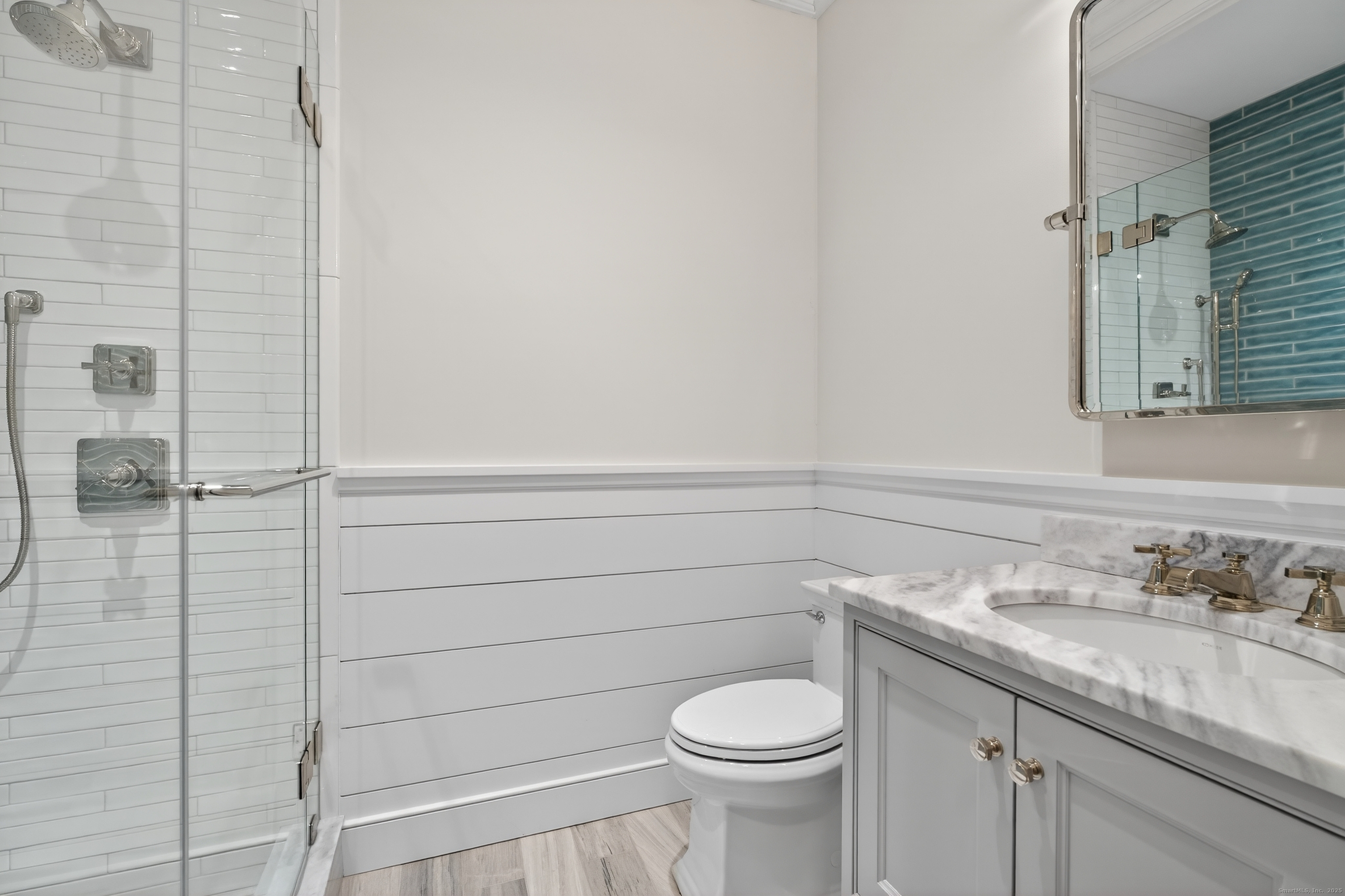 22 West Main Street, Unit 11 Groton, CT 06355 - Photo 25 of 40 a bathroom with a granite countertop sink and toilet