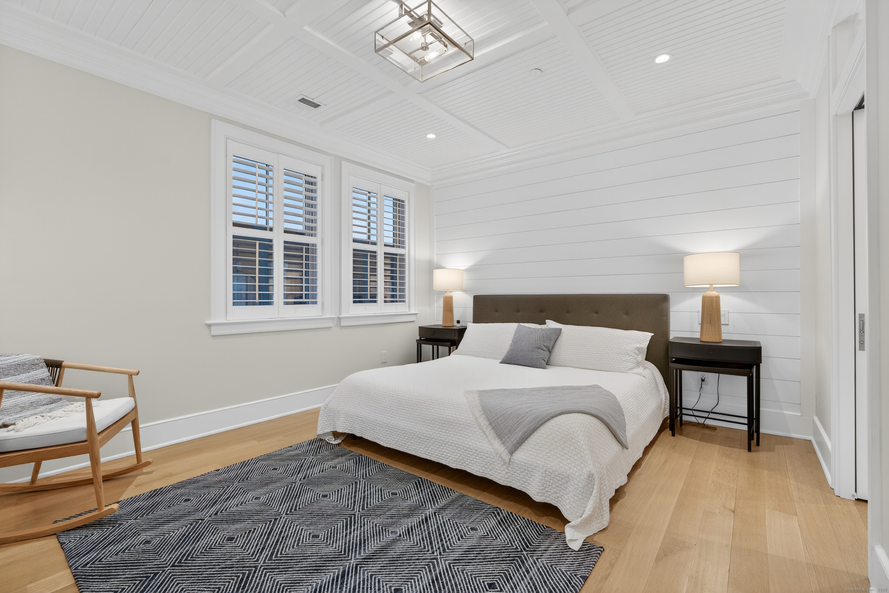 22 West Main Street, Unit 11 Groton, CT 06355 - Photo 26 of 40 a bedroom with a large bed and a window