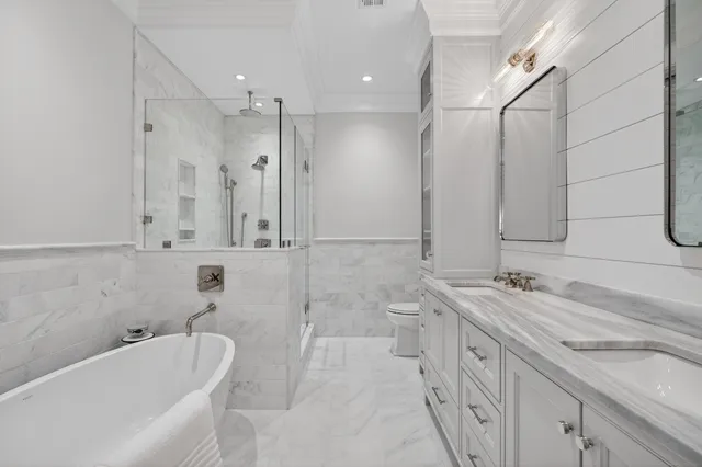 a bathroom with a bathtub and a toilet