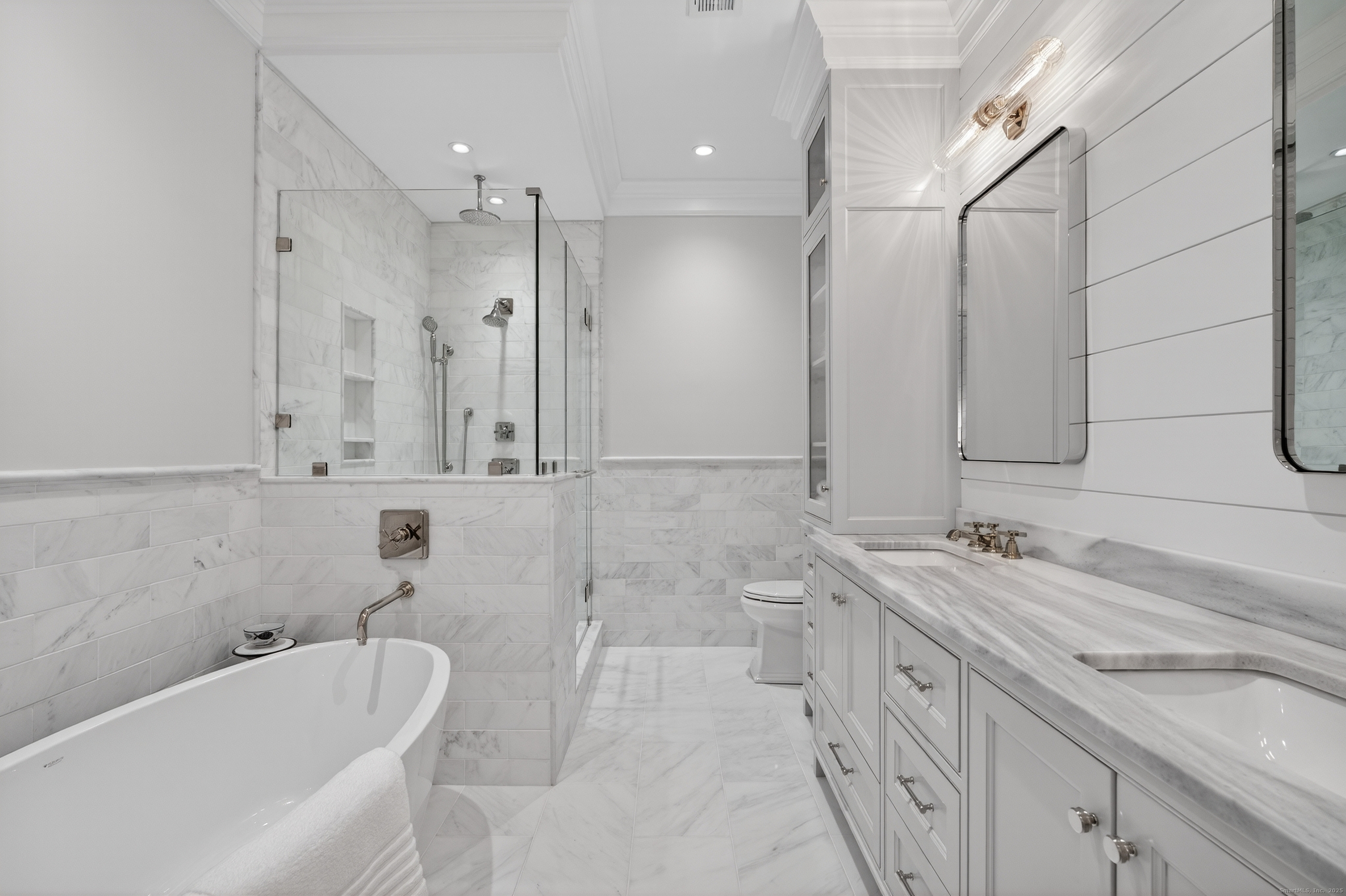 22 West Main Street, Unit 11 Groton, CT 06355 - Photo 28 of 40 a bathroom with a tub sink and mirror