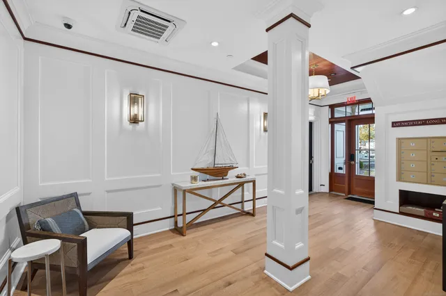 a living room with furniture a dining table and chairs