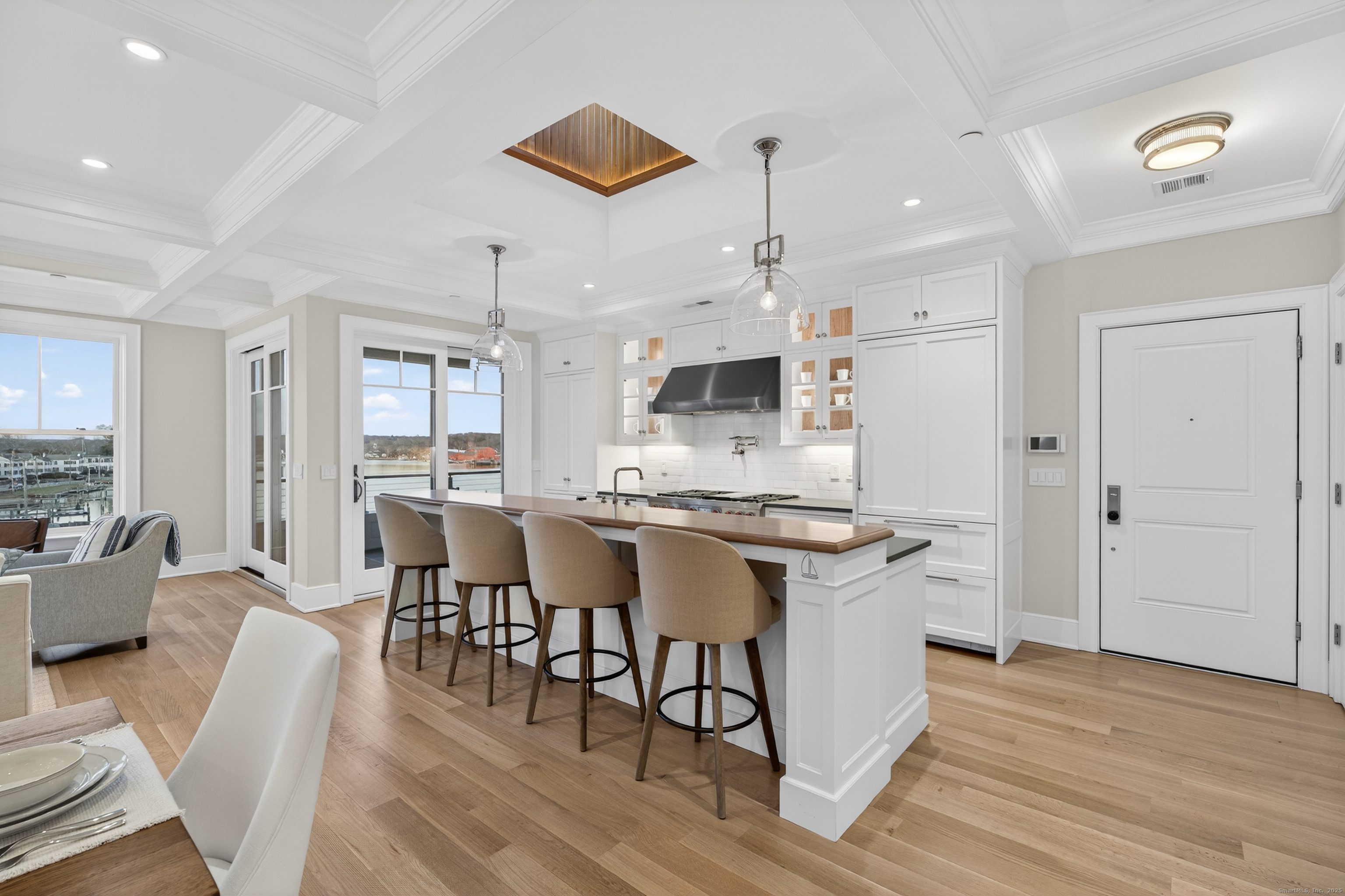 22 West Main Street, Unit 11 Groton, CT 06355 - Photo 6 of 40 a large kitchen with a table and chairs