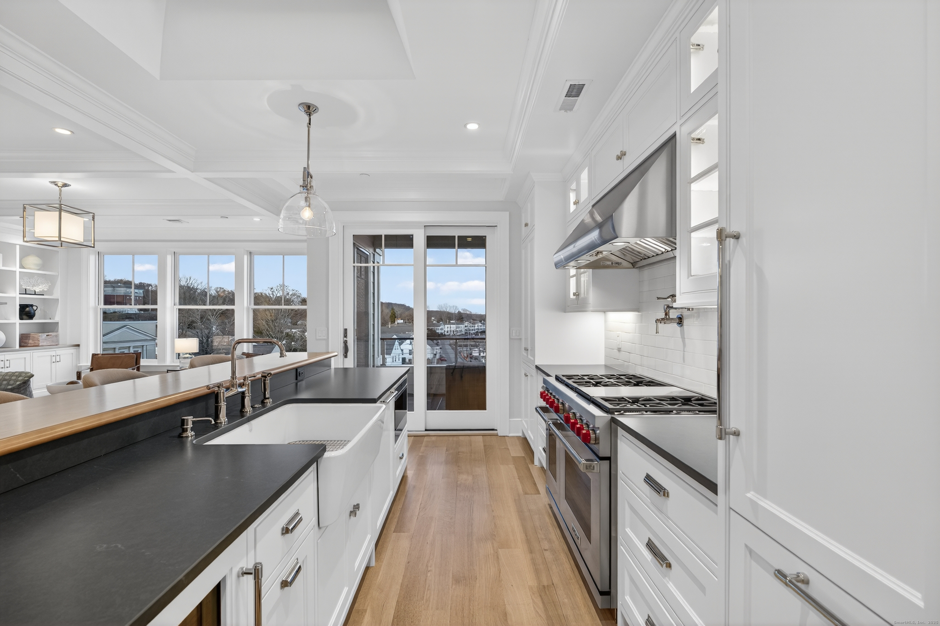 22 West Main Street, Unit 11 Groton, CT 06355 - Photo 7 of 40 a large kitchen with stainless steel appliances a lot of counter space and a window