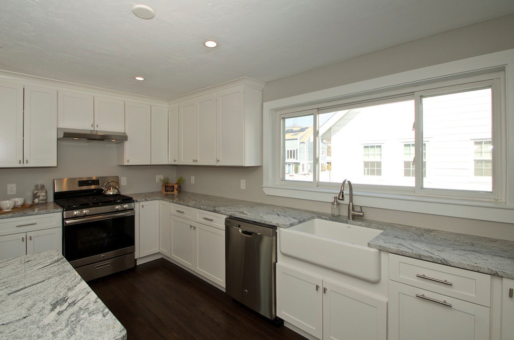 29 Hatherly Road Scituate, MA 02066 - Photo 14 of 29 a kitchen with a sink stove top oven and cabinets
