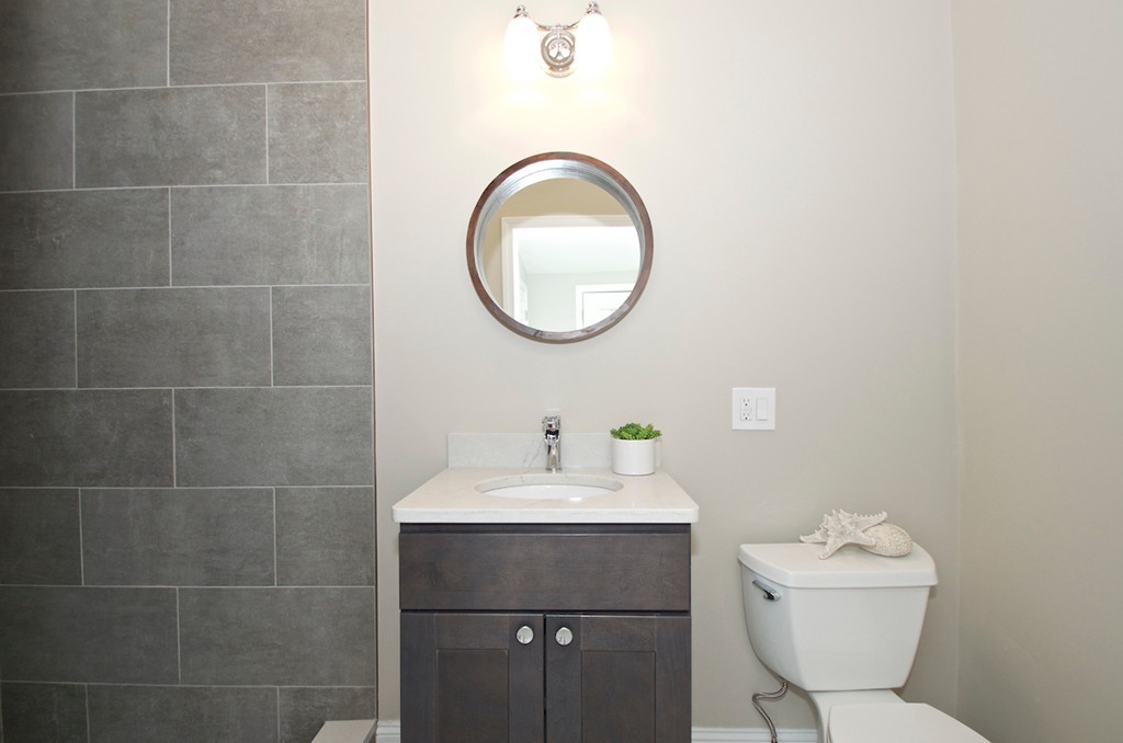 29 Hatherly Road Scituate, MA 02066 - Photo 17 of 29 a bathroom with a sink mirror and toilet