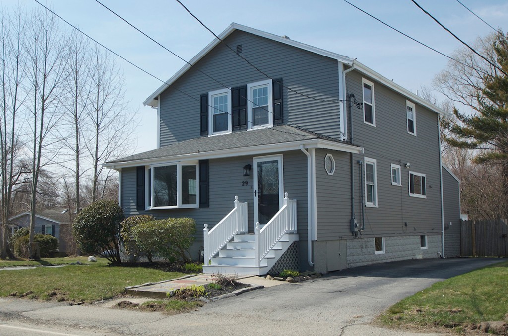 29 Hatherly Road Scituate, MA 02066 - Photo 2 of 29 a view of a brick house with a yard and large tree
