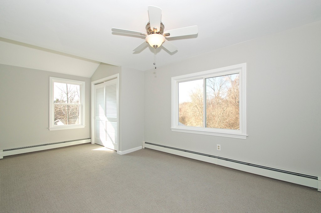 29 Hatherly Road Scituate, MA 02066 - Photo 26 of 29 an empty room with a window and a ceiling fan