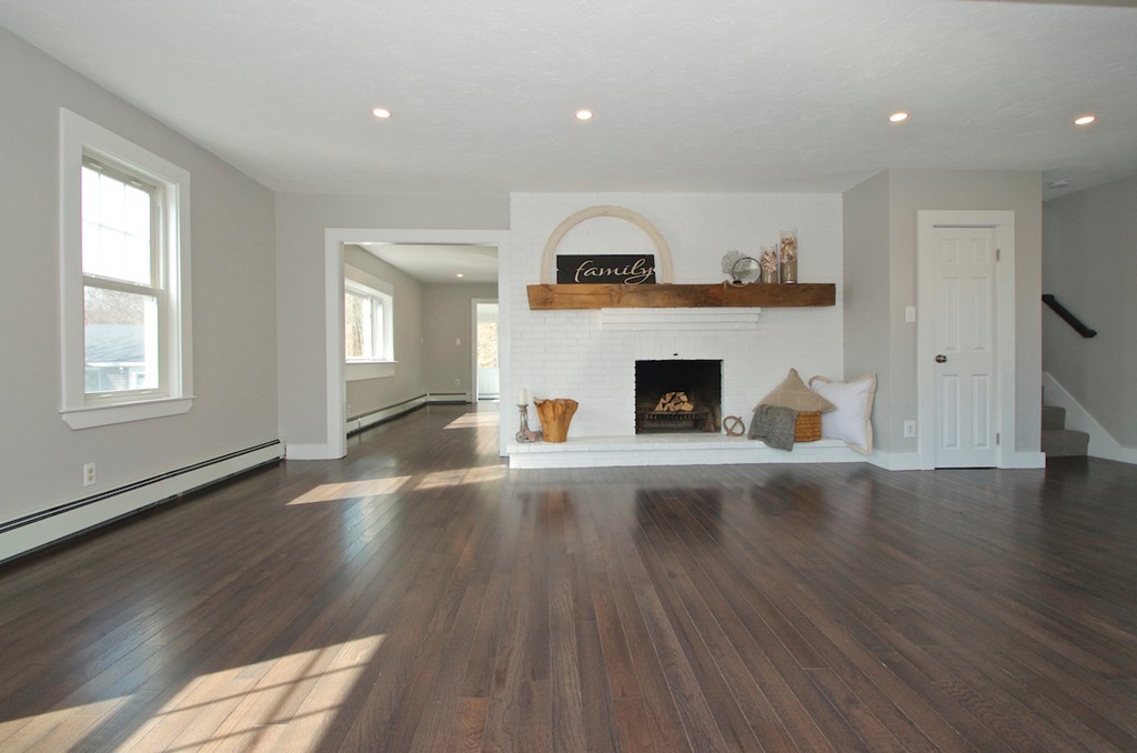 29 Hatherly Road Scituate, MA 02066 - Photo 7 of 29 an empty room with wooden floor a fireplace and windows