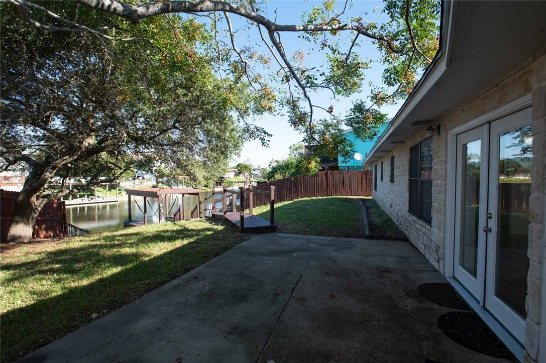 3442 Laguna Shores Road Corpus Christi, TX 78418 - Photo 11 of 15 a view of a backyard with a small cabin