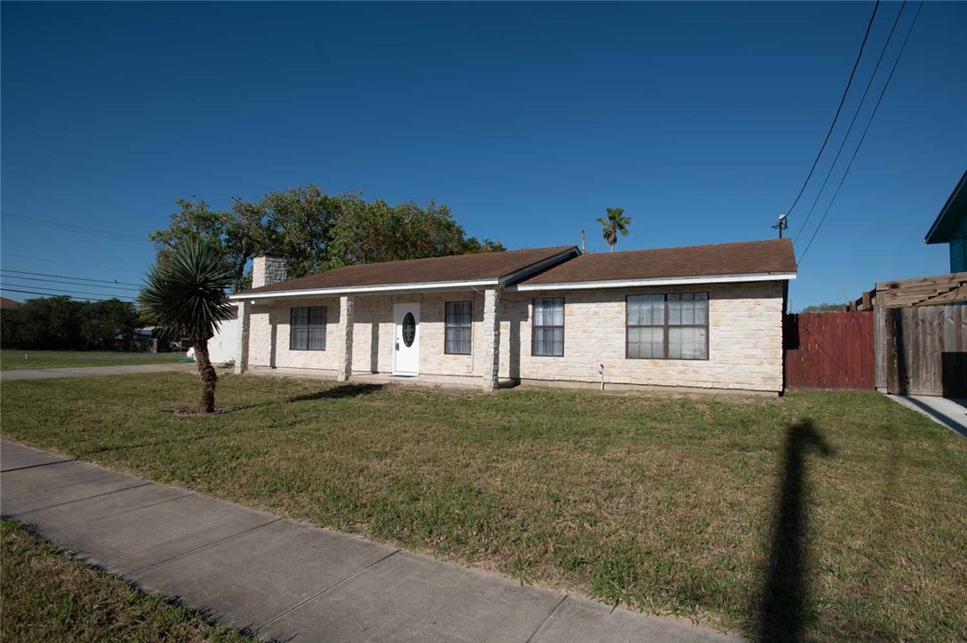 3442 Laguna Shores Road Corpus Christi, TX 78418 - Photo 13 of 15 a front view of a house with garden