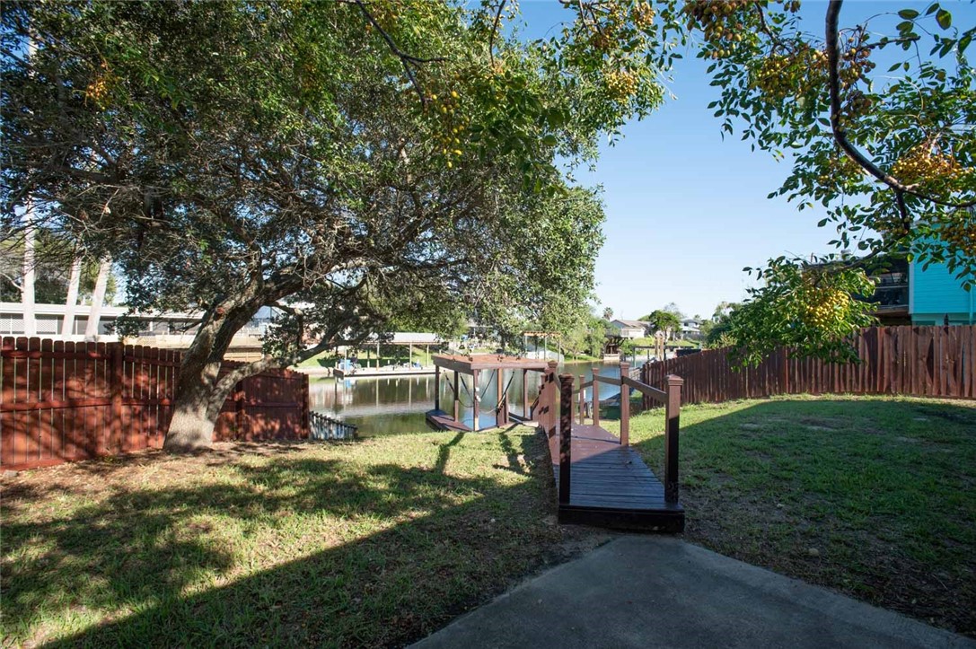 3442 Laguna Shores Road Corpus Christi, TX 78418 - Photo 2 of 15 a view of a park with large trees