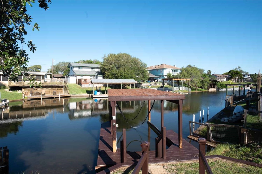 3442 Laguna Shores Road Corpus Christi, TX 78418 - Photo 3 of 15 a view of a lake with a table and chairs