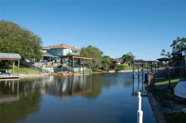 a view of residential house with outdoor space and lake view