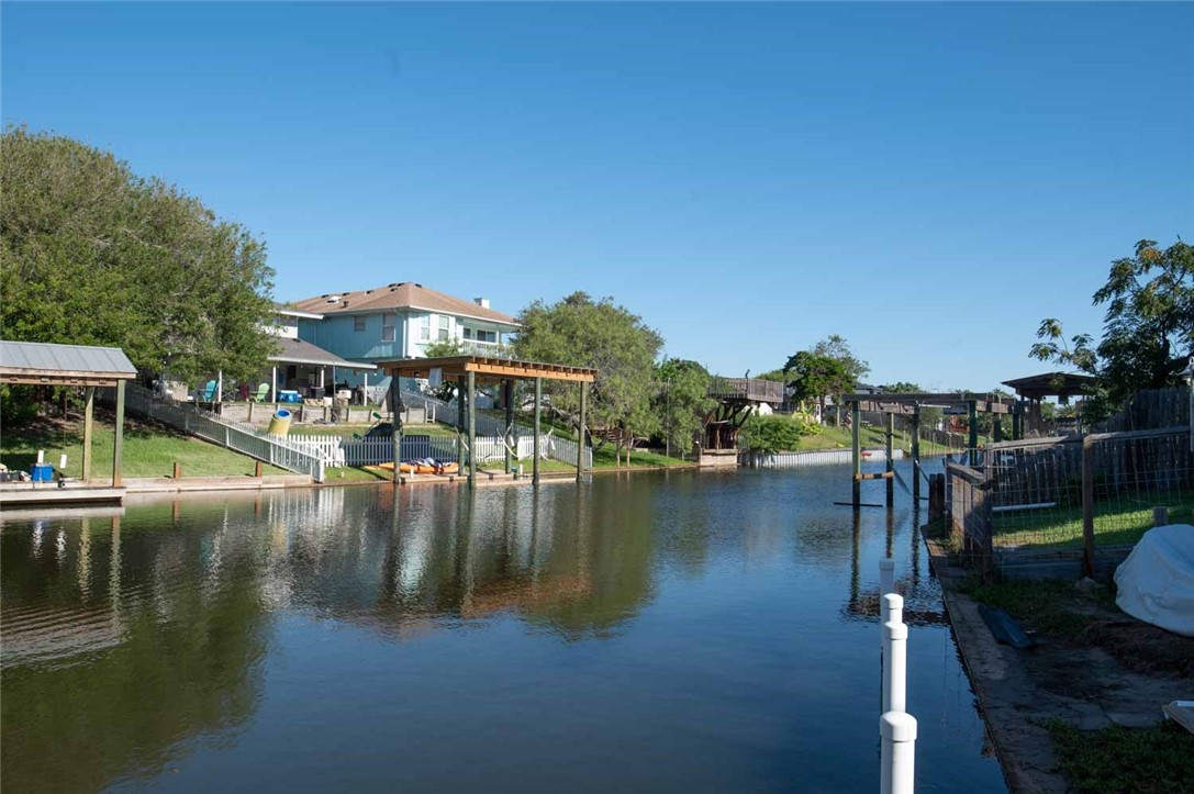 3442 Laguna Shores Road Corpus Christi, TX 78418 - Photo 6 of 15 a view of residential house with outdoor space and lake view