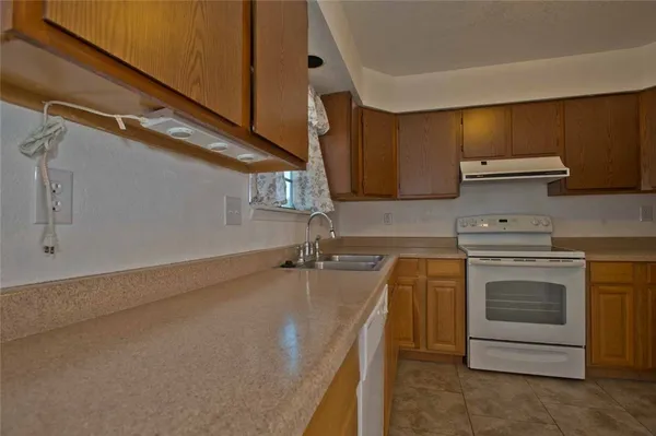 a kitchen with a stove and a sink