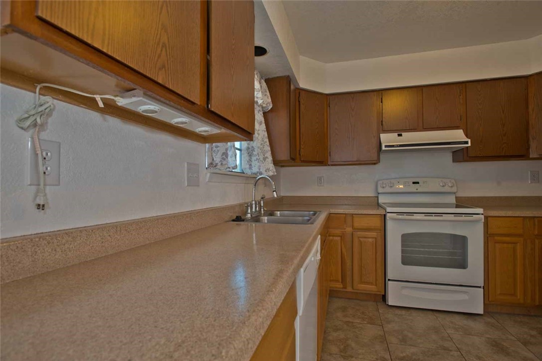 3442 Laguna Shores Road Corpus Christi, TX 78418 - Photo 9 of 15 a kitchen with a stove and a sink