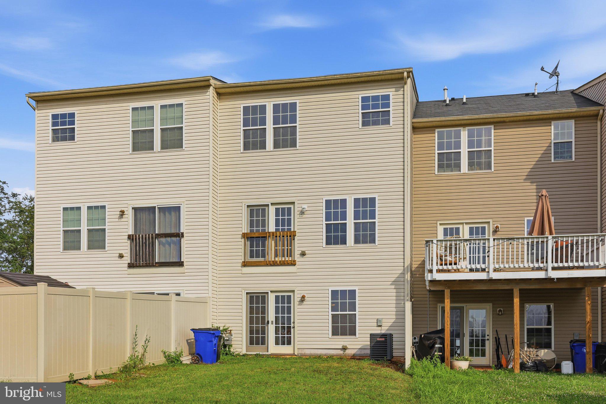 2075 Spring Run Circle Frederick, MD 21702 - Photo 45 of 59 a front view of a house with a yard