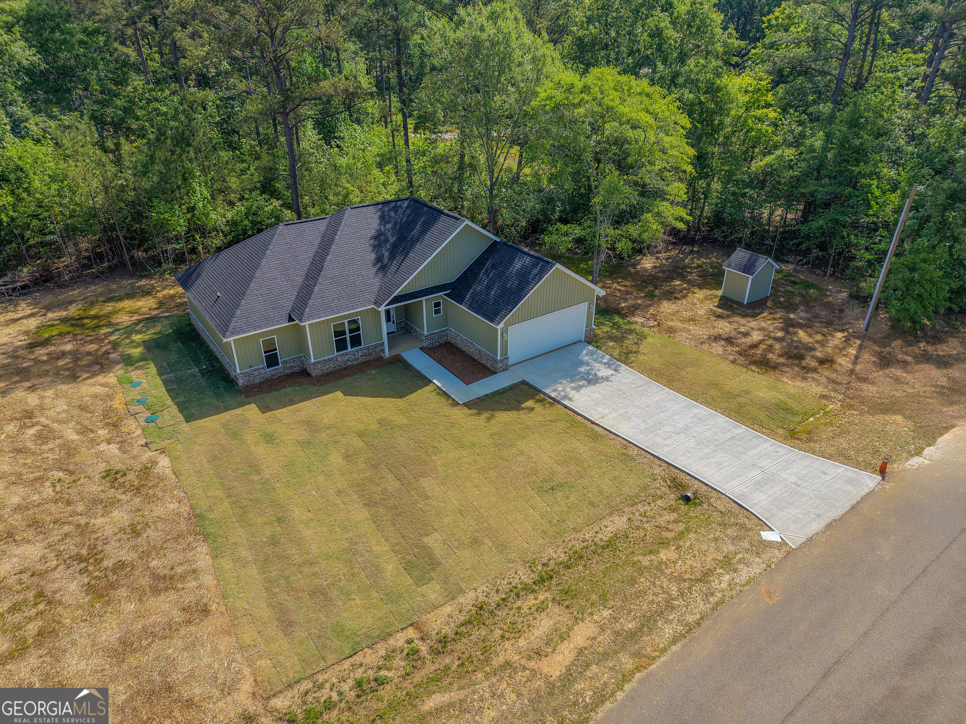 711 Flanders Lane Dublin, GA 31021 - Photo 46 of 49 a view of a backyard with a small pool