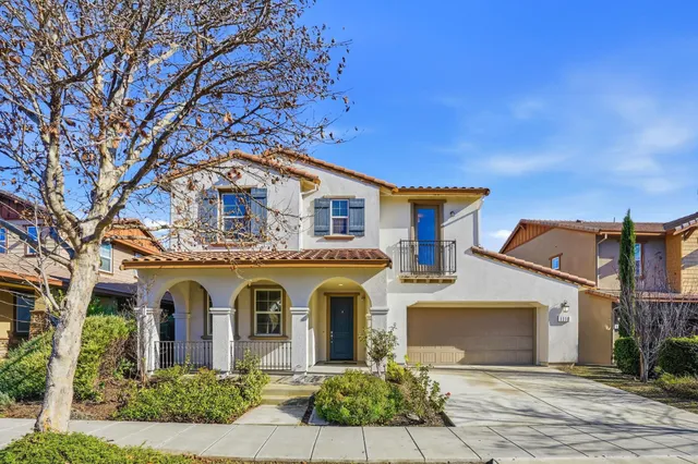 front view of a house with a dry yard