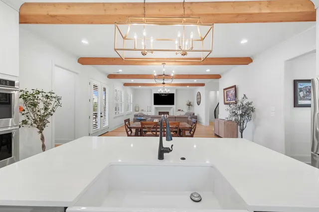 a view of a living room and kitchen